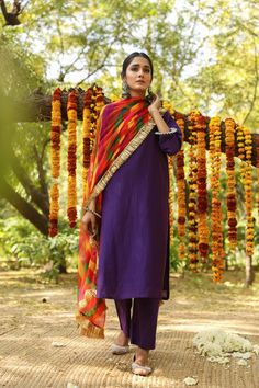 The set consists of purple solid straight cut kurta comes with 3/4th sleeves, round neck, calf length teamed with solid palazzo pants and multi color leheriya dupatta Fabric-Cotton Silk Color-Purple Dupatta Fabric-Leheriya Kurta Length-44 inches Pant Length-38 inches Work-Solid Neck-Round Sleeves-3/4th Sleeves Washing Instructions-Dry Clean Purple Palazzo Set With Pallu For Navratri, Navratri Purple Sharara With Straight Kurta, Purple Palazzo Set With Dupatta For Festivals, Purple Straight Kurta Sharara For Festive Occasions, Purple Sharara For Festive Occasions, Anarkali Purple Palazzo Set For Festivals, Bollywood Purple Palazzo Set For Diwali, Traditional Purple Straight Kurta With Pallu, Traditional Purple Palazzo Set For Diwali