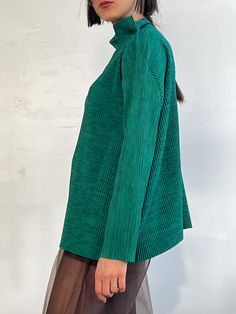 Classic forest green pleated ribbed top by Issey Miyake. Long sleeved with a raised neck fit. Excellent condition.MEASUREMENTS (in inches)52 in bust 62 in waist 26 in length MATERIALS polyHave a question? Email us All items are FINAL SALE. Vintage pieces are pre-loved and may come with minor flaws, condition will be noted in description. For questions or concerns, please Email us at hello@shopbanshee.com. If purchasing through Meta all policies still apply. Pleated Top, Easy Tiger, Pleat Top, Socks And Heels, Lk Bennett, Womens Turtleneck, Cropped Flares, Ribbed Top, Rachel Comey