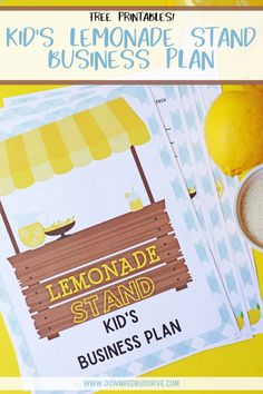 a lemonade stand is on the table next to some lemons