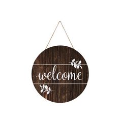 a wooden sign that says welcome hanging on a wall