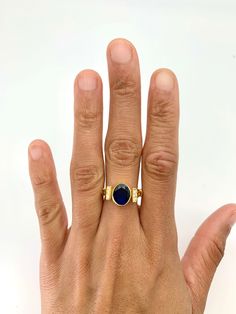 Vintage Sapphire Ring set with Created Sapphire in a diamond cut, flawless clarity & blue color, at size 10x8mm (3 cts). Gold Vermeil: 18k Gold over Solid 925 Sterling Silver ☞ made to last. Click here for ☞ Matching EarringsMatching Pendant ☞ Please ask me Details:• Created Sapphire in a flawless clarity• Sapphire: 10x8mm each, 3 Cts total, diamond cut• Dimensions: Band width ≈ 2.2mm, thickness ≈ 1.1mm• 18k Gold Vermeil SKU 2284 Elegant Sapphire Gemstone Signet Ring, Elegant Sapphire Signet Ring With Gemstone, Elegant Sapphire Moonstone Ring In Oval Shape, Timeless Oval Cabochon Sapphire Ring Gift, Elegant Sapphire Color Moonstone Ring, Elegant Blue Oval Cabochon Signet Ring, Elegant Sapphire Signet Ring With Polished Finish, Blue Oval Moonstone Ring In 14k Gold, Elegant Blue Sapphire Signet Ring