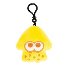 a yellow and white stuffed animal with an eye patch on it's face is hanging from a black hook