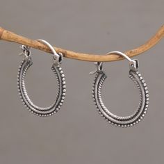 Versatile and stylish, these are earrings you can where anywhere. The hoop earrings are crafted from sterling silver and feature beaded textures on the outside of the hoop and rope-like motifs on the inside of the hoop. Oxidizing adds depth to the design, which is the work of Bali's Rupadana. materials: 925 sterling silver Combination finish Saddleback / sea catch earrings 1.1 in. L x 1 in. W Work Earrings, Silver Smithing, Unusual Earrings, Dope Jewelry, Classy Jewelry, Funky Jewelry, Sterling Silver Hoop Earrings, Dangly Earrings, One Inch