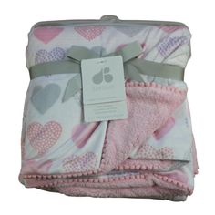 a pink blanket with hearts on it