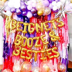 balloons and streamers decorate the entrance to a birthday party