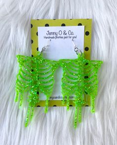 "You pick your glitter color LARGE skeleton earrings! Earrings hang from .925 solid sterling silver ear wires made in the USA. Size is approximately: 3.75\" Long and 1.75\" wide. See the glow in the dark style here: https://www.etsy.com/listing/864370661/glow-in-the-dark-skeleton-earrings-glow?ref=shop_home_active_1 I ship all earrings on various cardstock designs in 3 1/2\" x 3 1/2\" eco friendly reusable high quality jewelry boxes made in the US. I package up to 2 pairs in each box and tie eac Red Pierced Halloween Earrings, Glitter Skeleton, Halloween Novelty Metal Earrings, Dark Skeleton, Halloween Novelty Drop Earrings, Candy Corn Earrings, Skeleton Earrings, Laser Projects, Costume Earrings