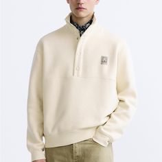 New With Tags. Zara Men Sweatshirt. Size S Casual Cream Polo Sweater For Winter, Casual Beige Polo Sweater, Casual Cream Sweater With Button Closure, Casual Zara Sweatshirt, Casual Cream Crew Neck Polo Sweater, Casual Crew Neck Sweatshirt With Buttons, Casual Winter Sweatshirt With Button Closure, Cream Relaxed Fit Sweater, Casual Cream Polo Sweater With Ribbed Collar