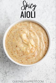 an overhead view of a bowl of spicy aioli on a marble surface with the title above it