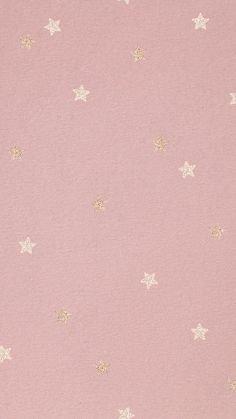 a pink background with gold stars on it