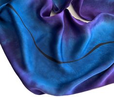 Create a stunning look with this azure blue and purple hand painted silk scarf. The black line design is hand drawn with a permanent fiber maker. This scarf would also make a great gift.  Measurements of the scarf are 10.5 inches wide by 58 inches or 26.6700 cm by 147.3200 cm. With a medium weight this silk charmeuse scarf is very soft and has rolled hems. For care instructions hand washing is recommended using cool water and mild soap. The silk dyes have been set. Hang the scarf to dry. While the scarf is slightly damp, iron using the low or silk setting. Blue Silk Scarf, Hand Painted Blue Silk Scarf, Purple Silk Scarf, Hand Painted Silk Scarf, Azure Blue Scarf, Purple Scarf, Gift For Her To view more hand painted scarves and ties visit seedreamsstudio.etsy.com loreenwestern on Instagram Purple Silk Scarf, Blue Silk Scarf, Purple Scarf, Hand Painted Scarves, Purple Hands, Purple Scarves, Hand Painted Silk Scarf, Painted Silk, Hand Painted Silk