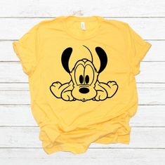 Pluto Shirt Tee Disney Pluto Shirt Disney Vacation Shirt | Etsy Cute Yellow Cotton T-shirt, Playful Yellow Top With Cartoon Print, Cute Yellow Top With Character Print, Playful Yellow Top With Funny Print, Cute Yellow Tops With Character Print, Cute Mickey Mouse Cotton T-shirt, Yellow Cotton Tops With Character Print, Cute Yellow Pre-shrunk Tops, Cute Yellow Crew Neck T-shirt