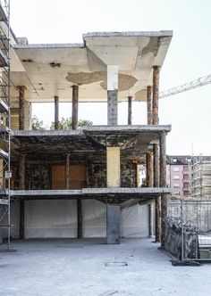 an unfinished building with scaffolding around it