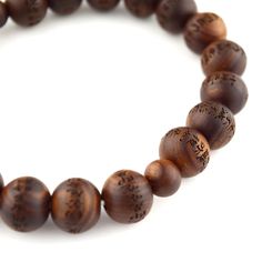 Japanese Sendan Wood Chinaberry Wood Heart Sutra Beads Bracelet Material : Sendan wood (Chinaberry wood), Silk elastic cord Length : about 16cm / 17cm / 17cm Head bead : about 10mm / 12mm / 15mm Main beads : about 7mm / 10mm / 12mm Handmade in Kyoto, JAPAN The beads of this bracelet have Heart Sutra on every beads. Melia azedarach ( Sendan Wood) , commonly known by many names, including chinaberry tree, Pride of India, bead-tree, Cape lilac, syringa berrytree, Persian lilac, and Indian lilac, is