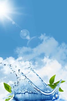 water splashing on the surface with green leaves and blue sky in the back ground