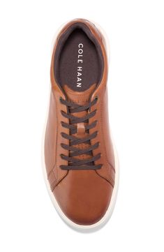 A casual yet refined silhouette is fashioned from durable materials and features lightweight cushioning, boosting the versatility of this sneaker. Leather upper/textile lining/rubber sole Imported Cole Haan, Dark Chocolate, Nordstrom Rack, Rubber Sole, Leather Upper, Nordstrom, Sneakers, Leather