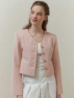 This piece of clothing is a textured jacket featuring a notched lapel and a three-button closure. This piece of clothing is a textured jacket featuring a notched lapel and a three-button closure. It is tailored with a structured fit and includes two patch pockets on the front. The sleeves are full-length, and the overall design exudes a formal yet contemporary aesthetic.- The jacket presents a sophisticated appearance with its notched lapels and button details.- Patch pockets add both function and a casual touch to the otherwise formal item.- Its textured fabric contributes to a rich, tactile experience and visual depth. Tweed Blazer With Hidden Button Closure And Lapel Collar, Tweed Blazer With Hidden Button Closure And Notch Lapel, Elegant Button-up Tweed Jacket For Office, Tweed Blazer With Button Closure And Lapel Collar, Elegant Button-up Tweed Jacket With Double Button Closure, Chic Single Breasted Tweed Jacket With Lapel Collar, Double-breasted Tweed Blazer With Button Closure, Chic Tweed Blazer With Button Closure, Chic Single-breasted Tweed Jacket With Lapel Collar