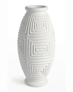 a white vase is shown on a white background