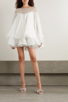 Rime Arodaky's mini dress is perfect for any bridal occasion. It's designed with a tulle neckline embellished with sparkling beads and has tiers of white silk-organza that fall to structured ruffles at the hem. The billowy sleeves add to its beautiful volume. Style yours with tonal sandals and minimal jewelry. Rime Arodaky, Billowy Sleeves, Silk Organza, Red Mini Dress, White Silk, White Mini Dress, Tulle Dress, Blouse Dress, Ruffle Dress