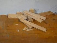 a pile of wood sitting on top of a wooden floor