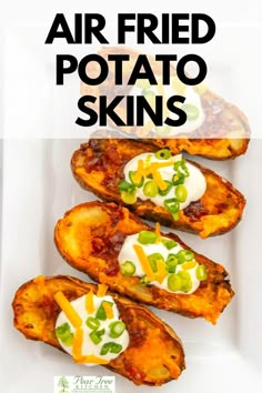 baked potato skins with cheese and green onions in the middle on a white plate text overlay reads air fried potato skins