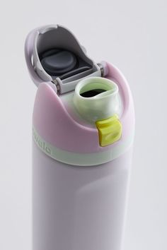 a pink and white water bottle with a cup in it