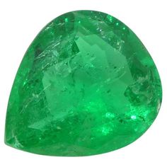 a large green gems stone on a white background