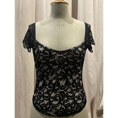 Black Floral Scroll Stretch Lace , Lined In Nude. Very Low Scoop Neck And Wide Set Cap Sleeves In Vintage Scallop Lace. Photographed On A Size 8 Mannequin Unworn, Pristine. Party Tops With Lace Trim And Underbust Shape, Black Coquette Tops For Party, Black Coquette Party Tops, Gothic Lace Tops For Party, Black Underbust Top For Party, Summer Black Coquette Tops, Black Coquette Summer Tops, Gothic Lace Party Tops, Coquette Black Summer Tops