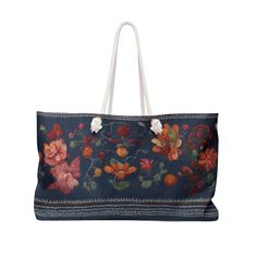 a blue floral bag with white handles and two flowers on the front, hanging from a string