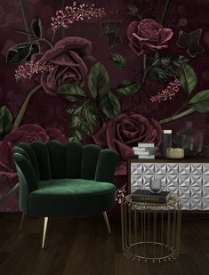 a green chair sitting in front of a purple rose wallpaper