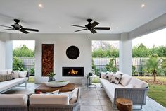 a living room filled with furniture and a fire place