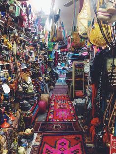 a store with lots of colorful rugs and other items