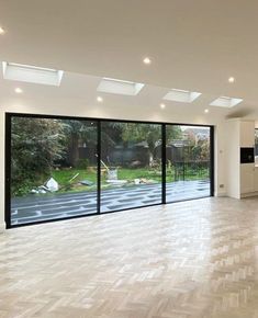 an empty living room with sliding glass doors