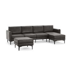 a sectional couch with ottoman and footstool in grey leather, viewed from the front