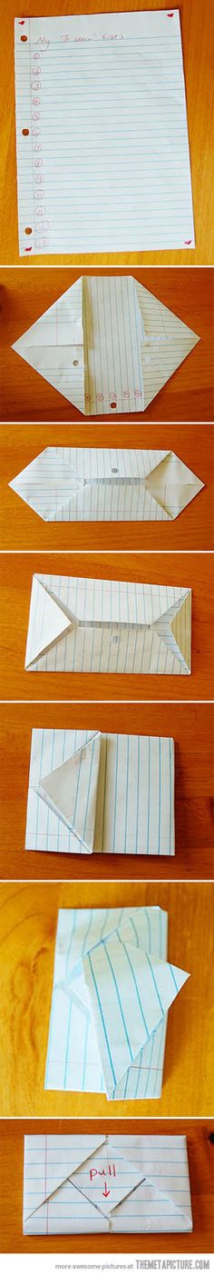 four paper airplanes sitting on top of a wooden table