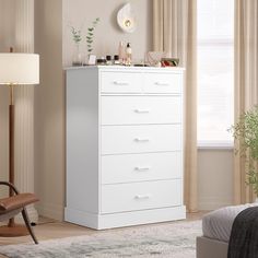 a white chest of drawers in a bedroom