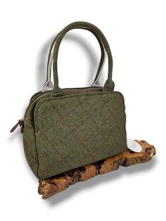 Introducing the stylish Cora tweed Top handle tweed bag as part of our range of tweed. Upgrade your style with this timeless piece, that combines both fashion and function. Elevating the classic material into contemporary fashion.  The bag boasts an elegant and classic design that exudes sophistication. The backpack features a zip closure providing security for your belongings. There are also two additional compartments either side of the zip, secured by a magnetic closure. The reverse also dons Classic Tweed Rectangular Bag, Classic Rectangular Tweed Bag, Classic Rectangular Tweed Shoulder Bag, Classic Tweed Bags For Everyday Use, Classic Tweed Bag For Everyday Use, Classic Tweed Bags For Everyday, Rectangular Tweed Shoulder Bag For Travel, Fall Tweed Shoulder Bag, Tweed Satchel Bag For Everyday Use