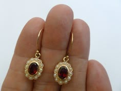 These elegant Women's Vintage Garnet and Pearl earrings will add extra appeal to your attire when wearing for the night out or for special occasions These superbly crafted earrings have been handmade in 9ct Solid Yellow Gold with reference to a vintage design Luxurious Oval cut NATURAL Garnets have been bezel set and magnificently milgrain edged and inlayed with 24 GENUINE Seed Pearls set by a Master Jeweller ! **Photos 4 & 5 shows these earrings in White Gold Precious Metals These pair of G Handmade Bezel Jewelry, Seed Pearl Earrings, 40s Jewelry, Vintage Earrings Victorian, Vintage Garnet Earrings, Vintage Pearl Jewelry, Vintage Pearl Earrings, Girls Fit, Earrings With Pearls