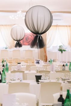 the tables are set up with white linens