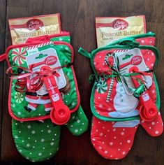 two oven mitts that have been decorated with red and green christmas decorations on them