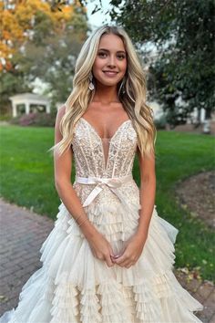 a woman in a wedding dress posing for the camera