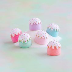 there are many small cakes that have sprinkles on top of each one