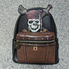 Disney Pirates Dead Men Tell No Tales Design Faux Leather Mini Backpack, Applique, Debossed And Printed Details, Metal Coin Zipper Pull Bag Charm, Adjustable Padded Shoulder Straps, Top Handle Side Slip Pockets, Front Zipper Pocket, Zipper Closure, Loungefly Logo Zipper Pulls, Interior Zipper Pocket, Coordinating Lining, Disney X Loungefly Enamel Logo Label Measures About 10.5"H X 9" W X 4.5" D Pirates Of The Caribbean Loungefly, Disney Pirates Of The Caribbean, Dead Men Tell No Tales, Disney Loungefly, Loungefly Bag, Disney Bag, Logo Label, Pirates Of The Caribbean, Dead Man