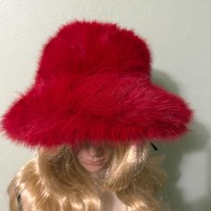 Beautiful Red Fluffy Hat. Very Soft and Warm. Fun Hat that is Fun to Wear.  Great addition to your wardrobe for Fall and Winter. It will keep you warm and make a fashion statement. This Hat is an Absolute Stunner it will turn heads.  Shape: Pom Pom Hat Size: small to medium Ribbon band adjusts to head size Material: Polyester Red Brimmed Top Hat For Winter, Red Wide Brim Winter Hat, Red Brimmed Costume Hat One Size, Red Wide Brim Top Hat For Winter, Red Mini Hats With Curved Brim For Winter, Red Brimmed Winter Hat, Red Brimmed Mini Hat, One Size Fits Most, Red Brimmed Mini Hat, Red Wide Brim Mini Hat For Winter