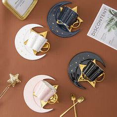 the table is decorated with gold, black and white decorations