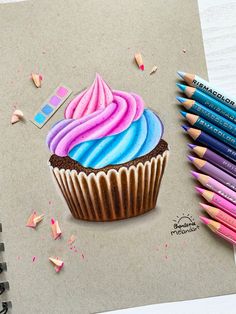 a drawing of a cupcake with pink, blue and purple frosting on it