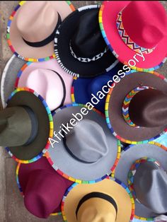 Beautifully beaded Set of 5 fedora hats. They contain the beadwork both at the brim and at the edge. Available in different colours and all you need is to tell us your preferred colours.  Wholesale for more than 5 fedoras also available  Free shipping Is also an added advantage and its via DHL EXPRESS Beaded Hat Brim Free Pattern, Beaded Hat Brim, Fedora Hat Style, Beaded Hats, Fedora Fashion, Jingle Dress, Beaded Hat Bands, African Hats, Hats Summer