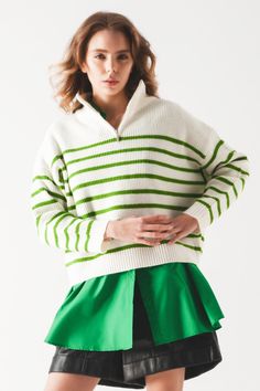 The stunning zip-up collar in this sweater is emblematic of the classic polo shirt and updated into a comfy, chunky knit striped jumper. Zip it up and you have a turtleneck. Or unzip it, as shown in our photos. This sweater boasts of stunning green strips on a white background, drop shoulders, ribbed trims, long sleeves, a zip fastening, and knit fabric that is made from 45% Acrylic, 28% Polyamide, and 27% Polyester. Consider layering it over our Oversized Shirt in Bold Green and our Black Leath Nautical Sweater, Trendy Sweaters, Vintage Inspired Fashion, Comfortable Sweater, Stylish Sweaters, Green A, Chic Sweaters, Detailed Sweater, Nautical Fashion