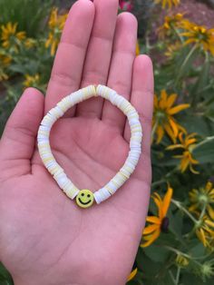 White and yellow clay bead bracelet. Made with clear elastic string that fits most teen writs. Trendy White Plastic Bracelets, Trendy White Plastic Bracelet, Casual Yellow Bracelets With Letter Beads, Playful White Plastic Jewelry, Casual Adjustable Stretch Bracelet, Playful White Adjustable Bracelets, Playful Adjustable White Bracelets, Casual Plastic Stretch Bracelet With Letter Beads, Playful Yellow Friendship Bracelets With Letter Beads