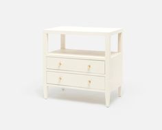 a small white table with two drawers