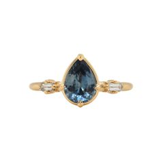 This one of a kind ring features a 1.11ct Montana blue sapphire and accented with lab diamonds. Finished in 14k yellow gold. Designed in D.C. by SHELTER. Yellow Gold Pear-shaped Sapphire Ring, Montana Blue Sapphire, Pear Sapphire Ring, Vintage Sapphire Ring, Diamond Band Engagement Ring, Montana Sapphire, Alternative Engagement Rings, Bridal Bands, Shop Engagement Rings